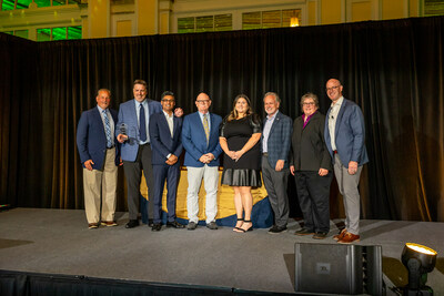 From left to right: Flavio Bortolotto (Director, Sales, Sandridge Crafted Foods), Kevin VanderMeer (Regional Account Manager, Sandridge Crafted Foods), Arpen Shah (VP, Merchandising Strategy and Analytics, SpartanNash), Michael Sandridge (VP, Foodservice Sales, Sandridge Crafted Foods), Courtney Klemens (Brand Manager, Sandridge Crafted Foods), Tony Sarsam (CEO, SpartanNash), Marianne Schmidt (Director, Deli, SpartanNash), Bennett Morgan (SVP and Chief Merchandising Officer, SpartanNash).